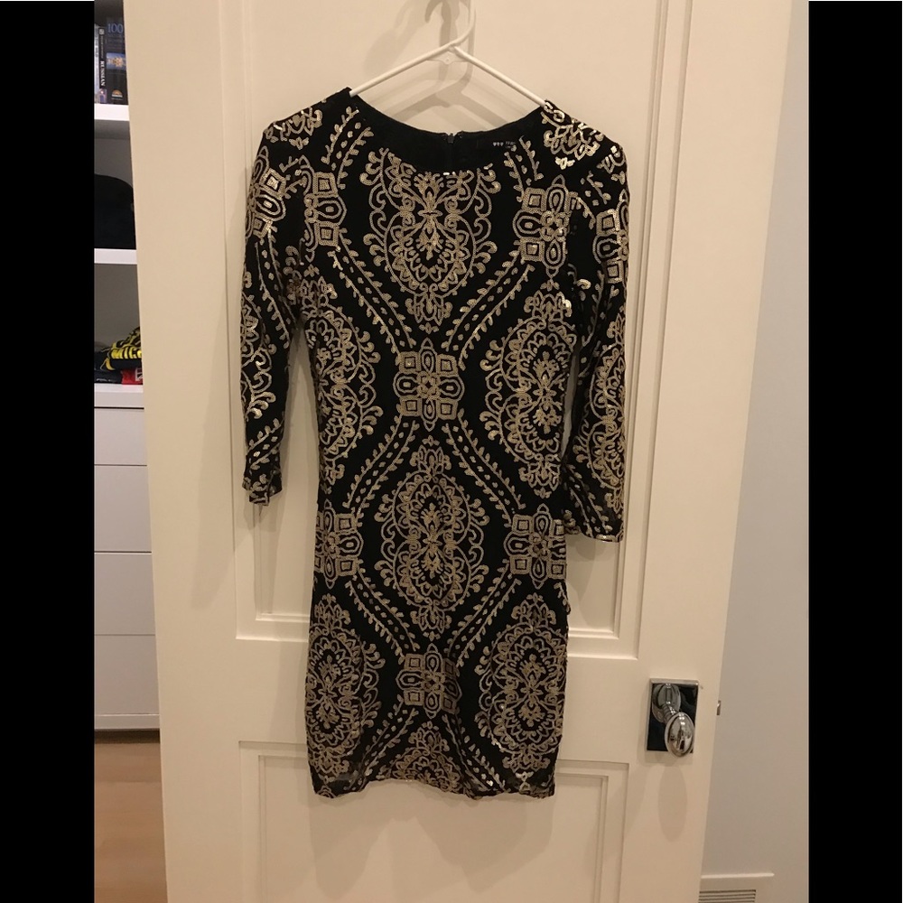 Black body-con dress with gold detail